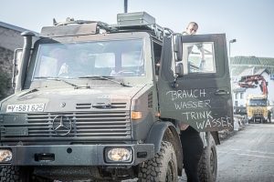 military trucks carrying arms supply